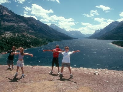 Waterton-Glacier National Park: Kids in Wind on Bluff by Prince of Wales Hotel