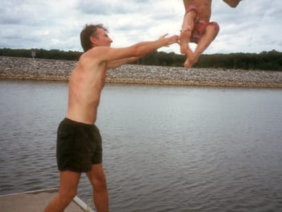 Friends Driveway in Western KY / Land Between the Lakes: Herb tossing Tommy in Lake Barclay