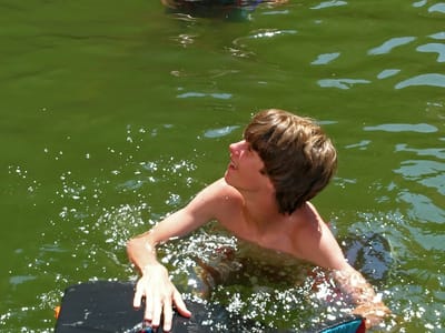 Lake Powell - Halls Crossing: Boy's demonstrating the use of the scrotum squeezer