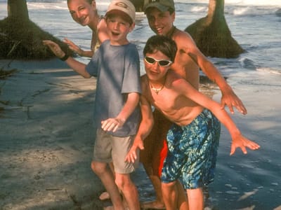 Hunting Island State Park: Kids \"skim boarding\" under palmetttos