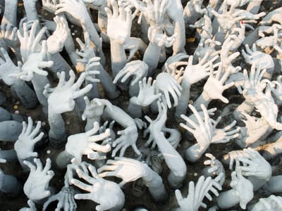 Chiang Rai: The beseeching hands of the suffering at the White Temple