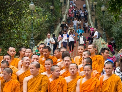 Chiang Mai: Monks about to earn Buddhist merits by climbing stairs to temple