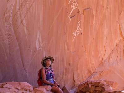 Lake Powell - Defiance House and across from Annie’s Canyon: Lolo sitting beneath an anatomically correct pictograph