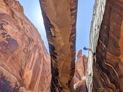 Moab: Rappeller descending from top of Morning Glory Natural Bridge
