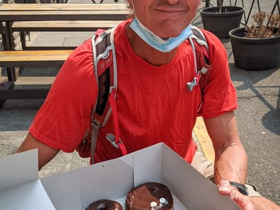 Portland: Herb enjoying his giant box of Voodoo Donuts