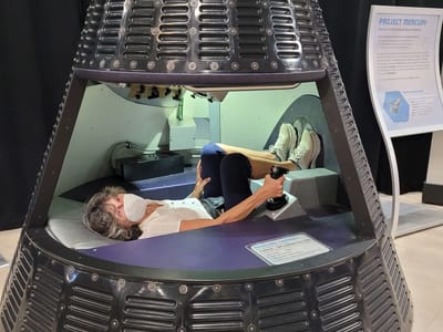 San Diego: Lolo trying to sneak in a nap at the Air and Space Museum