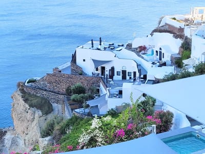 Santorini: Oia's whitewashed cubiform houses carved into the cliffs