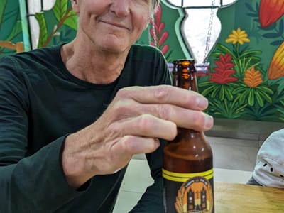 Quito: Herb enjoying his first beer in a basilica