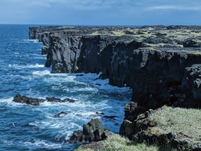 Snæfellsnes peninsula - Skarðsvík Beach and Svörtuloft lighthouse.: Svörtuloft Cliffs (Black Ceiling)