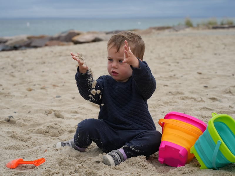 Nora enjoying the sand