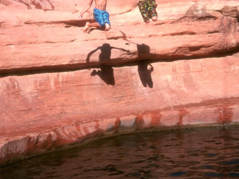 Boys jumping in Slide Rock State Park