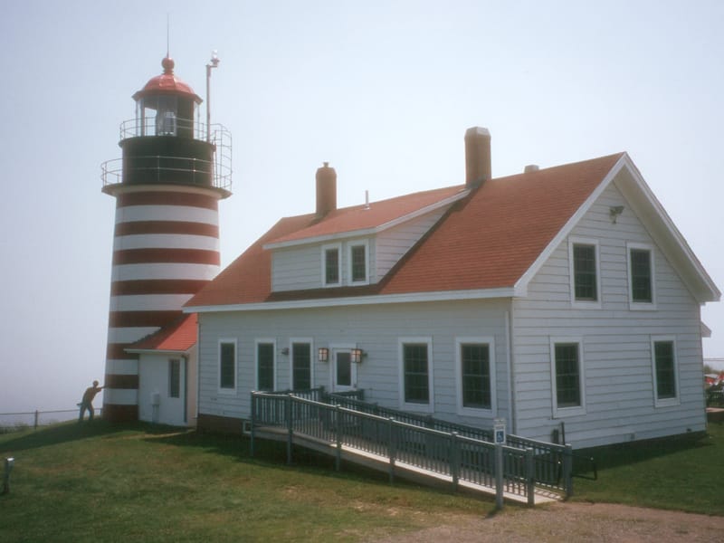 Herb holding up Quoddy Head Light