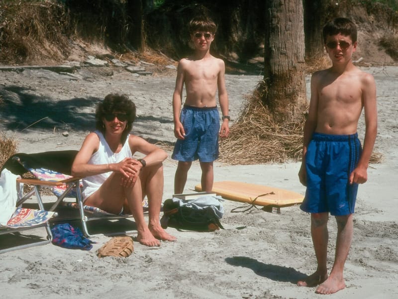 Lolo and boys under palmetto palms