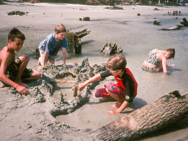 Kids making drip sand castles