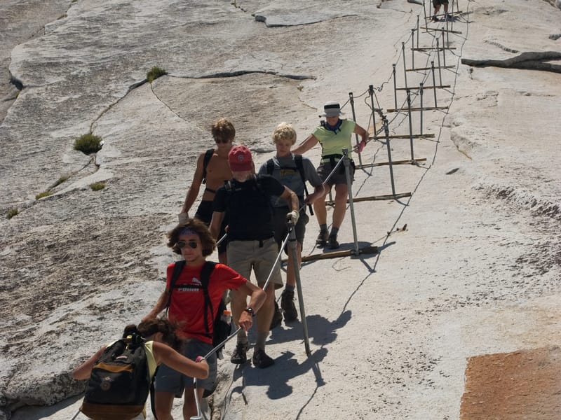 Lolo cautiously descending Half Dome cables