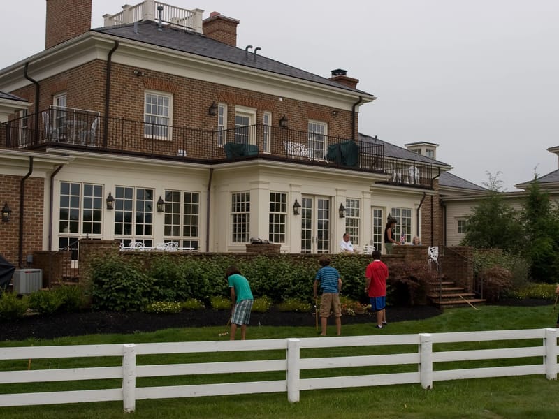 Gang playing croquet in the backyard