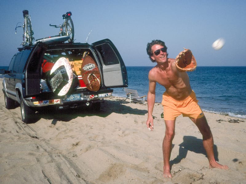 Herb playing catch on beach