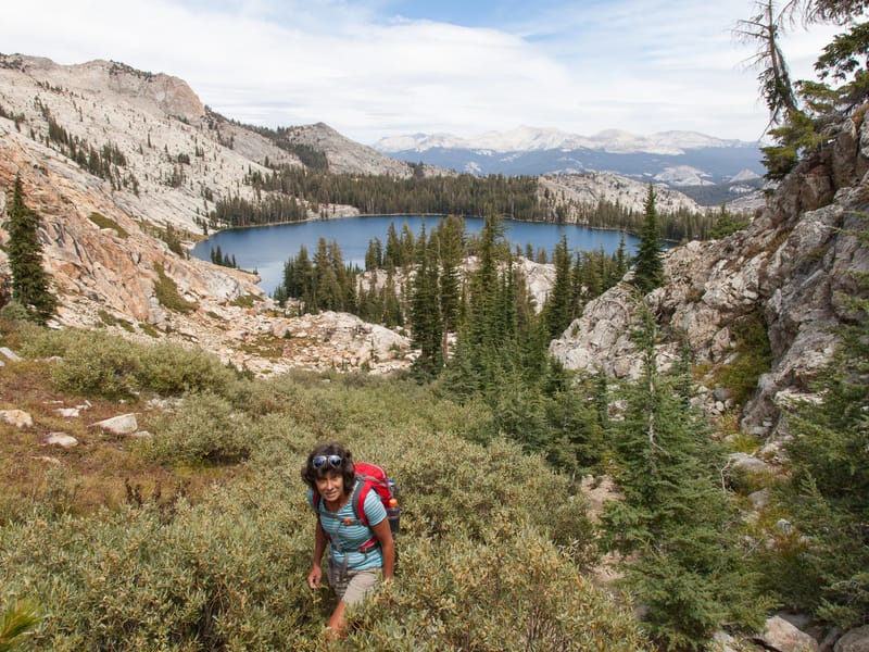 Lolo Hiking with May Lake in Background