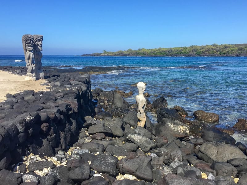 Vigilant gods gazing out to sea