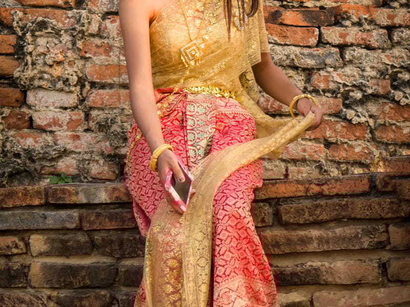Traditional Thai dress at Chai Watthanaram Temple