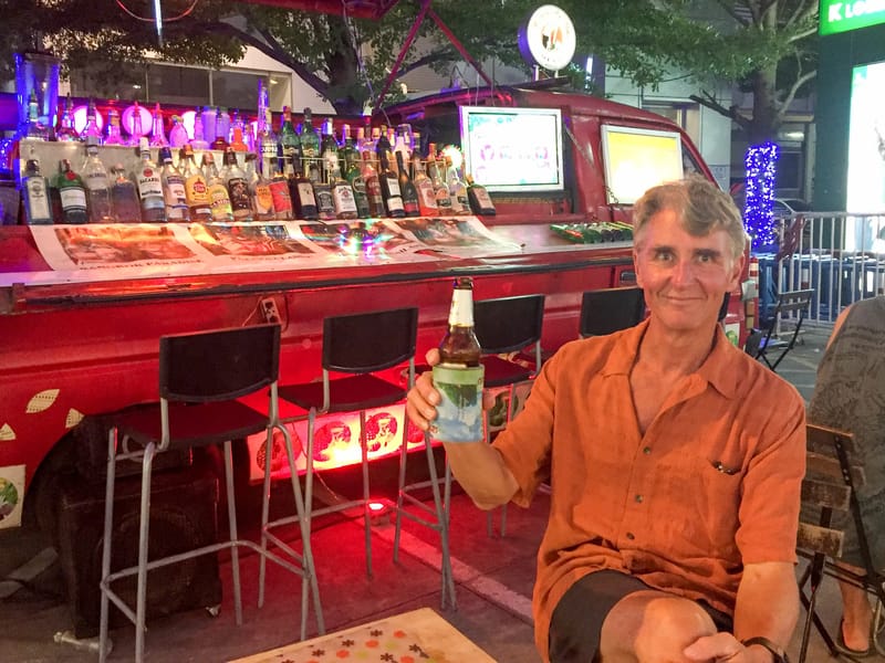 Herb enjoyinga beer at the Suvarnabhumi Night Market