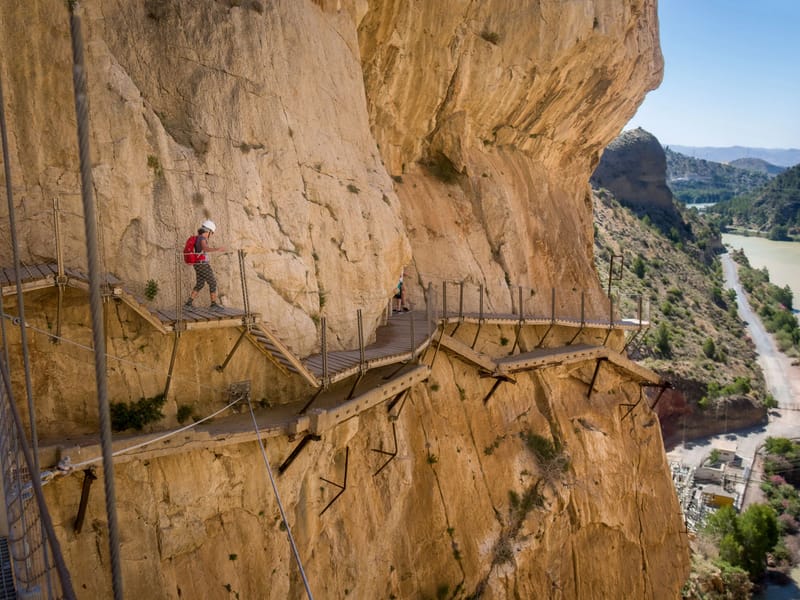 Lolo hiking on the new route, with the old deteriorated one below