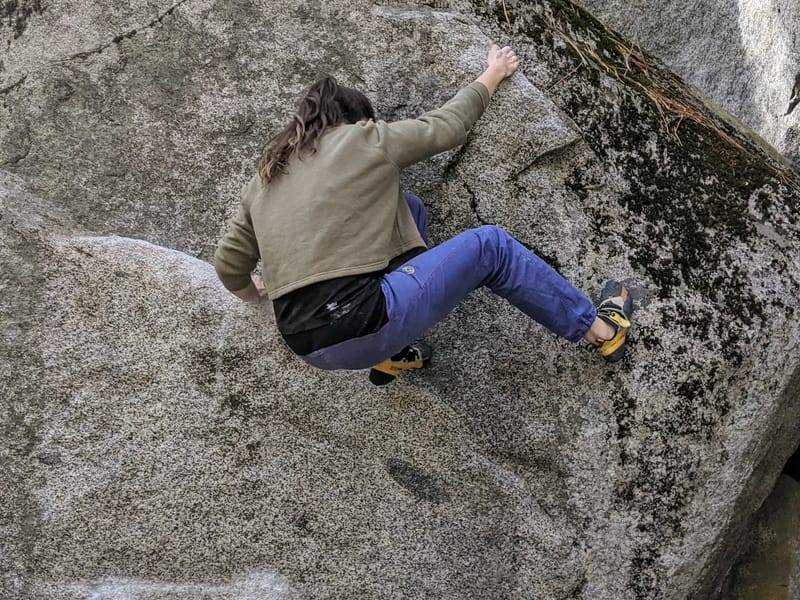 Erin bouldering without a wedding dress